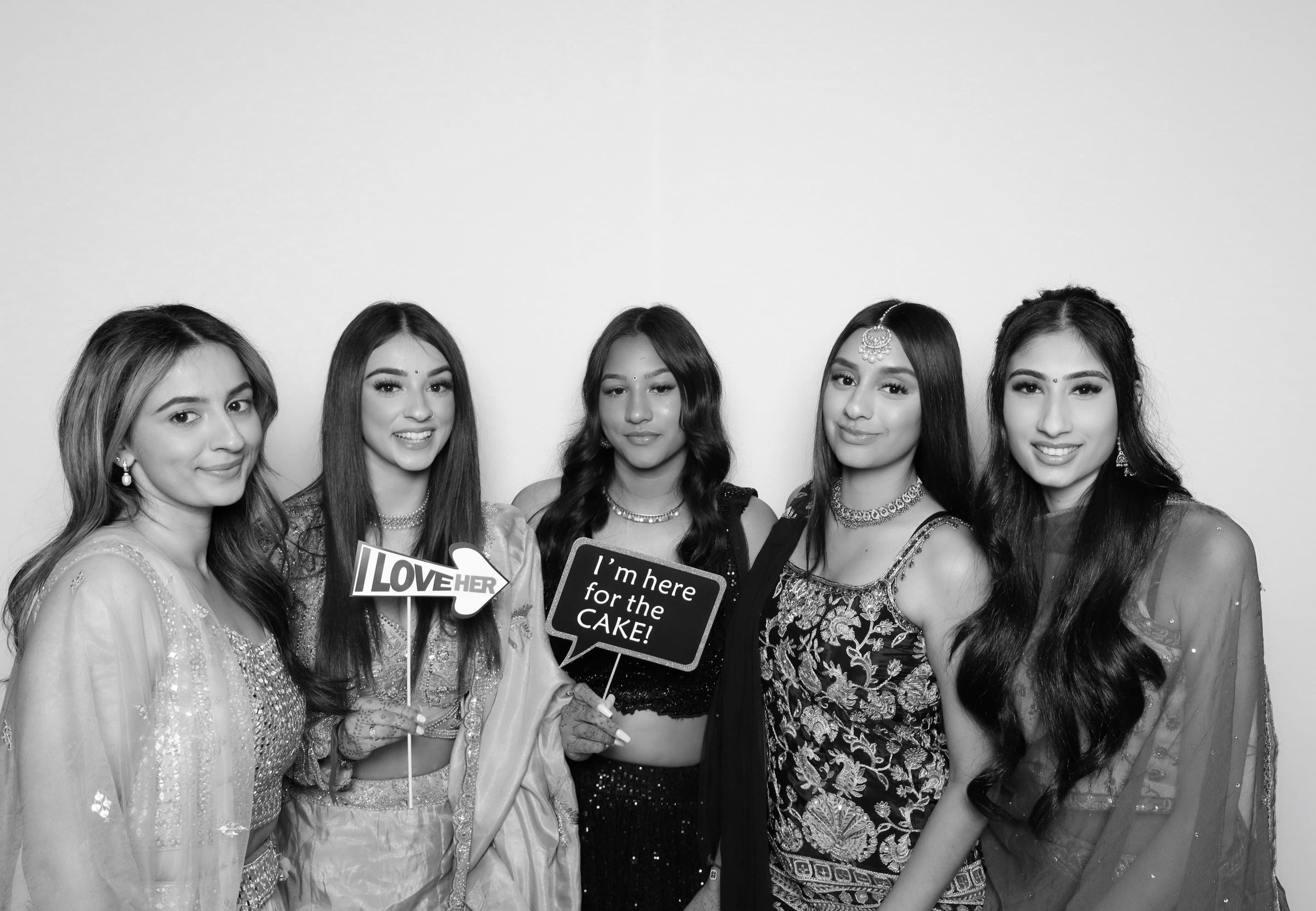 Five guests in formal attire at reception photo booth Vancouver