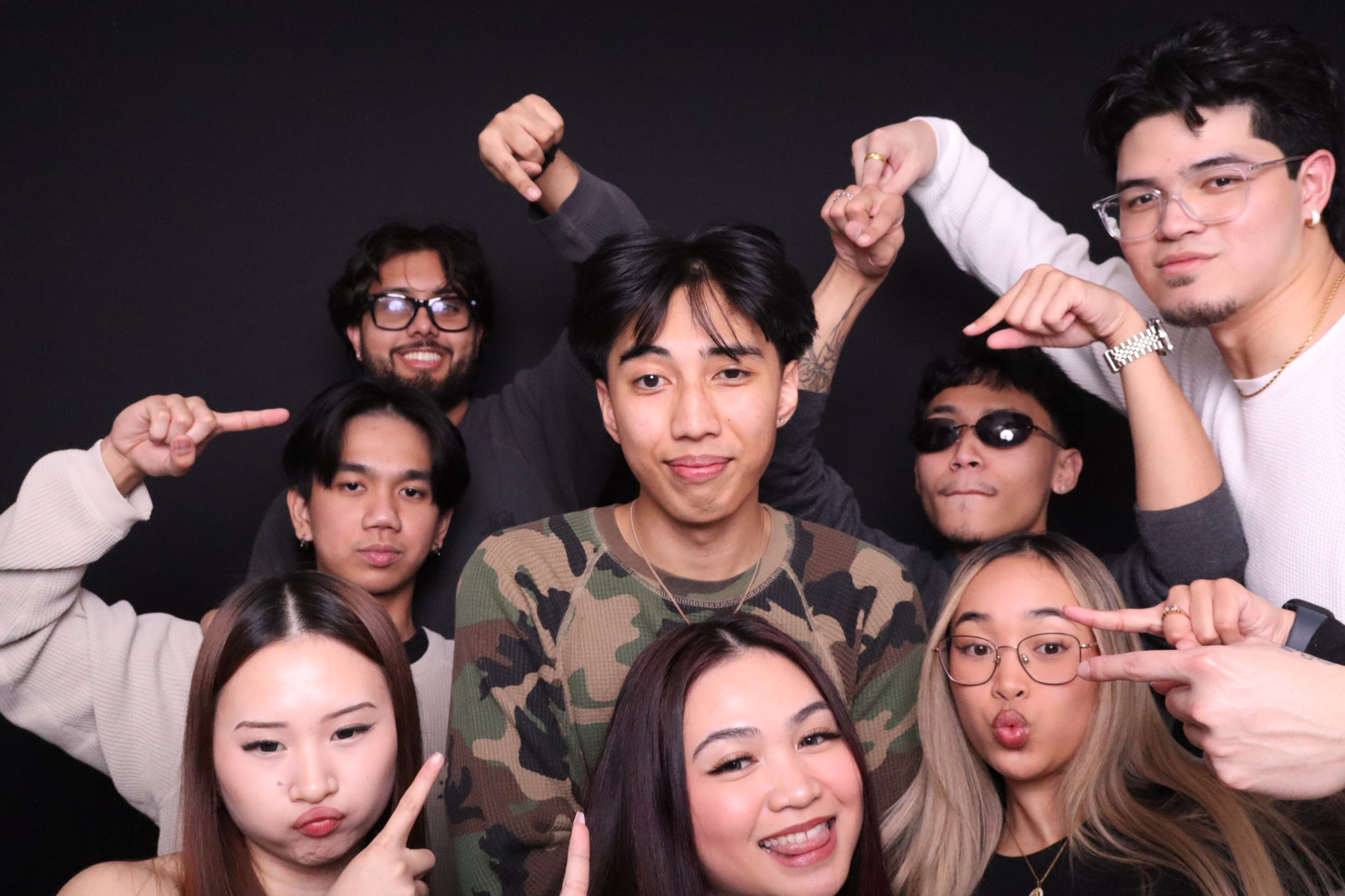 Mixed group posing at photo booth birthday party Vancouver