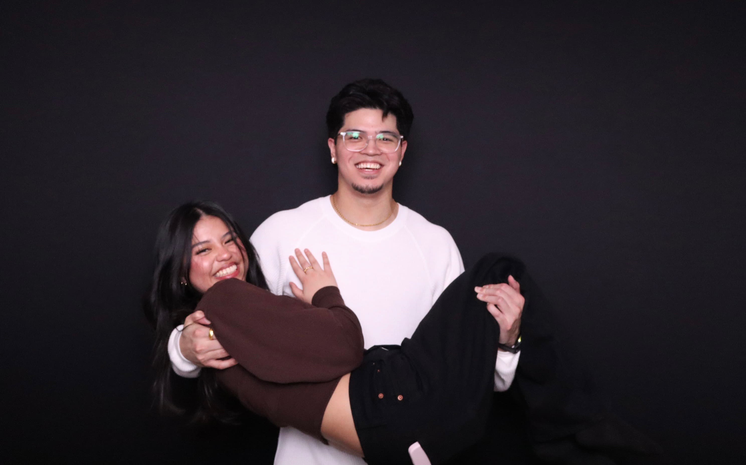 Couple laughing at West Coast Photobooth birthday party Vancouver