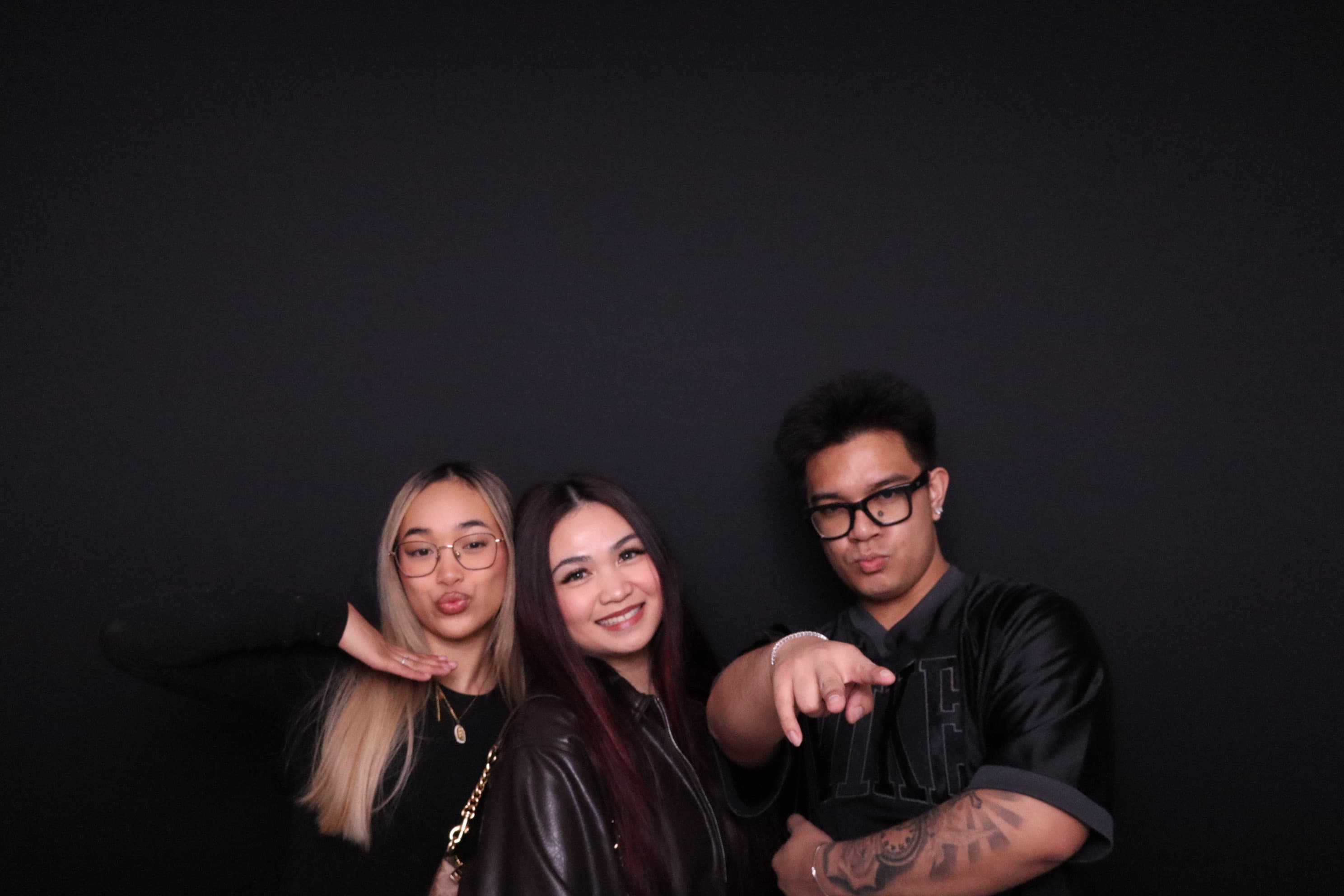 Group of three posing at birthday photo booth Vancouver